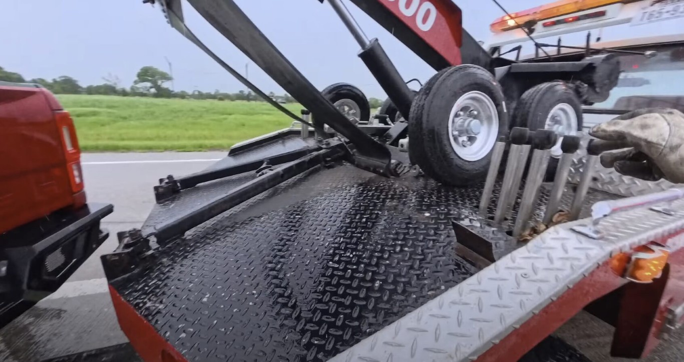 Motorcycle towing equipment and flatbed on highway