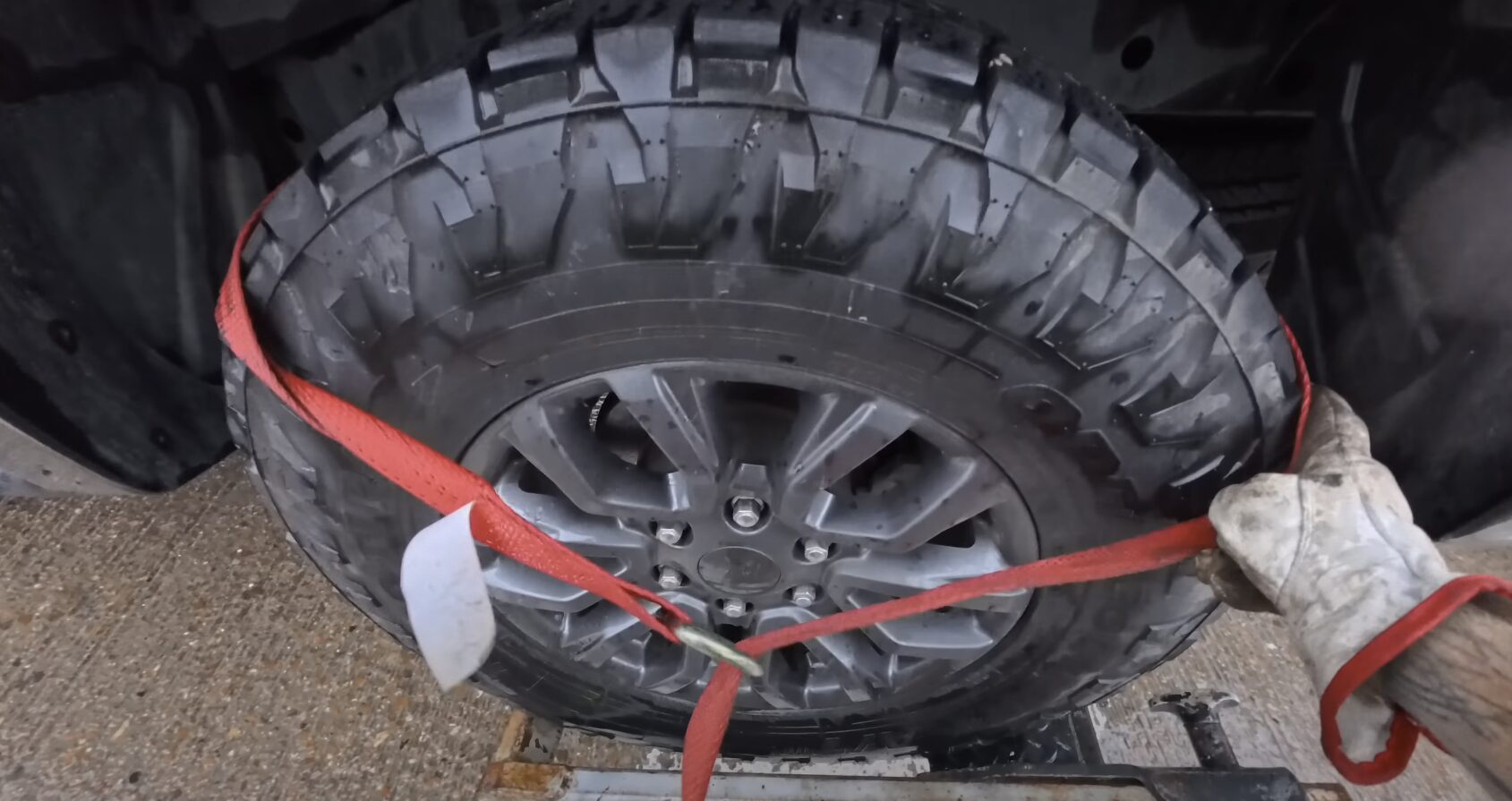 Vehicle secured on professional towing equipment